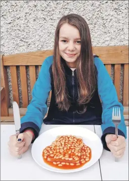  ?? ?? Jodie Allan gets ready to tuck in to ‘another’ plate of beans and toast.