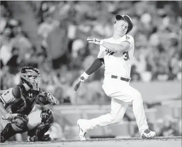  ?? Gary Coronado Los Angeles Times ?? JOC PEDERSON of the Dodgers loses his helmet swinging at a pitch by Matt Moore of the Giants in the sixth inning. Pederson struck out later in the at-bat, one of seven strikeouts Moore had in his near no-hitter.