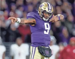  ?? STEPH CHAMBERS/GETTY IMAGES ?? Michael Penix Jr. reacts after a Washington first down against Washington State during the fourth quarter Nov. 25.