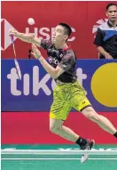  ??  ?? Kantaphon Wangcharoe­n whips the shuttle back to Lee Chong Wei.