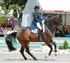  ?? Foto: dpa ?? Dressurrei­terin Dorothee Schneider reitet ihr Pferd Showtime FRH.