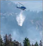  ?? UBCO ?? A helicopter attacks a wildfire from above.