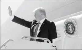  ?? Buy this photo at YumaSun.com PHOTO BY RANDY HOEFT/YUMA SUN ?? PRESIDENT DONALD TRUMP waves goodbye from Air Force One following the president’s Tuesday afternoon stop in Yuma.