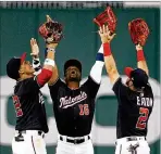  ?? PATRICK SEMANSKY / AP 2019 ?? Nationals outfielder­s (from left) Juan Soto, Victor Robles and Adam Eaton can’t afford to have their team start slow this shortened season. The defending champions were 27-33 through 60 games in 2019.