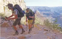  ?? ROSS D. FRANKLIN/ASSOCIATED PRESS FILE PHOTO ?? Hikers head out of the Grand Canyon in 2015. The National Park Service is floating a proposal to increase entrance fees at 17 of its most popular sites.