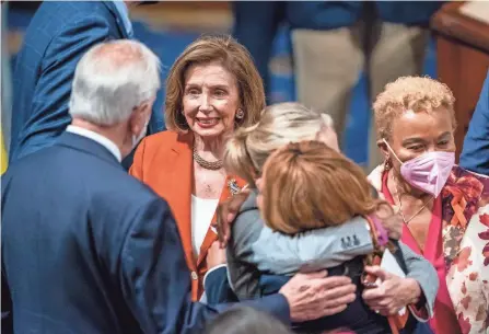  ?? J. SCOTT APPLEWHITE/AP ?? House Speaker Nancy Pelosi, D-calif., greets members of Congress on Friday after the passage of the gun safety bill in the House. The Senate passed the bill Thursday night and President Joe Biden signed it Saturday.