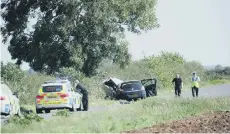  ??  ?? Police at the scene of the crash near Northborou­gh