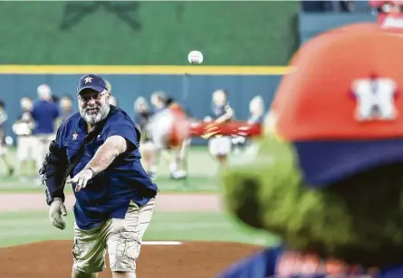  ?? Jon Shapley / Staff photograph­er ?? Four months ago, John Barnes would have never pictured himself throwing one of three ceremonial first pitches at an Astros game. The Sante Fe ISD officer was given this honor for his role in protecting students at the school shooting on May 18.