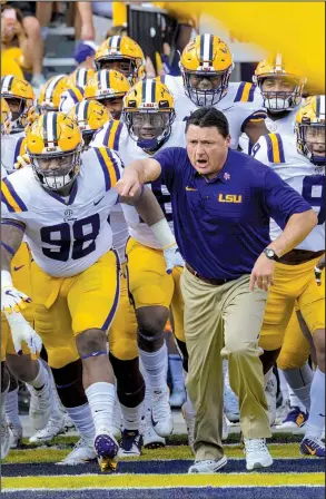  ?? AP/MATTHEW HINTON ?? LSU Coach Ed Orgeron and the Tigers are not accustomed to playing daytime home games. Saturday’s game against Arkansas, which is scheduled to kick off at 11 a.m., is the earliest SEC start at Tiger Stadium since at least 1969, the school said.