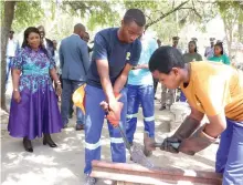  ?? ?? Environmen­tal patron First Lady Dr Auxillia Mnangagwa looks on as Rufaro High School learners shape scrap metal by heating and hammering it to make hoes, axes and other household tools during the national Clean Schools Competitio­n awards ceremony in Masvingo on Friday