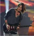  ??  ?? Keith Urban performs at the 2018 MusiCares Person Of The Year gala.