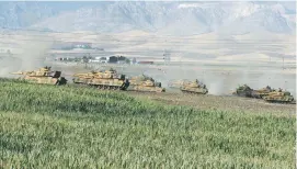  ?? (Umit Bektas/Reuters) ?? TURKISH TANKS maneuver yesterday in Silopi, near the border with Iraq, during a military exercise.