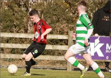  ??  ?? Glen O’Brien of Gorey Rangers is tracked by Aidan Walsh (Castlebar Celtic).