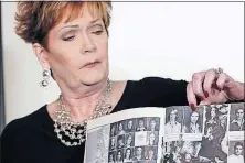  ?? ASSOCIATED PRESS] [RICHARD DREW/THE ?? Beverly Young Nelson, 56, the latest accuser of Alabama Republican Roy Moore, points to her photo in her high school yearbook during a news conference Monday in New York. She said Moore assaulted when she was 16.