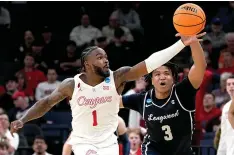  ?? ?? Houston guard Jamal Shead (1) grabs a loose ball away from Longwood guard DA Houston (3) on March 22 during a first-round college basketball game in the NCAA Tournament in Memphis, Tenn. (AP photo/george Walker IV)