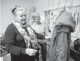  ??  ?? Costume designer Nancy Bryant, left, and Joanne Lesage, head of wardrobe, discuss costumes for A Christmas Carol.