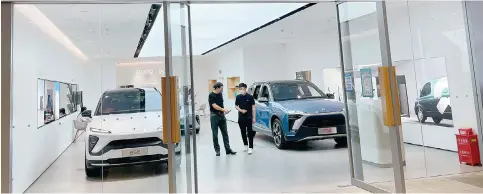  ?? Photo: Imaginechi­na ?? A Nio showroom at a shopping centre in Shenzhen. The company said it delivered 14,178 vehicles in November, up by 41 per cent from a month earlier.