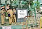  ??  ?? Police officers at the barricaded entrance of Hanwella Rubber Products Ltd.
Pic by Kushan Pathiraja