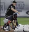  ?? JULIE JACOBSON — ASSOCIATED PRESS ?? Umpire Lance Barrett calls Francisco Lindor, left, out after Lindor collided with Didi Gregorius.