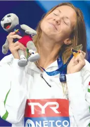  ?? — AFP ?? Gold medallist Boglarka Kapas poses on the podium after the women’s 200m butterfly swimming final at the Tollcross swimming centre during the European Championsh­ips in Glasgow on Monday.