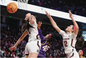  ?? Nell Redmond/Associated Press ?? South Carolina center Kamilla Cardoso, left, scored 18 points to help push the Gamecocks’ streak to 31 games with a win over previously unbeaten LSU.