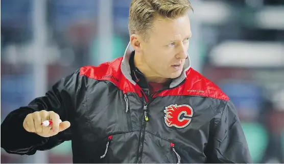  ?? AL CHAREST ?? Flames head coach Glen Gulutzan, seen here Friday at Flames training camp, is making a positive initial impression with the players thanks to his friendly style.