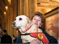  ??  ?? Proud owner Amanda Garner with therapy dog Bess, a deserving recipient of the pet blessing ceremony.