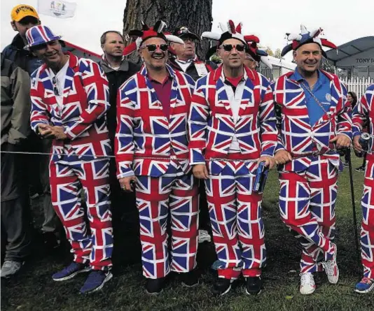  ??  ?? SHOWING THEIR TRUE COLOURS: These supporters are dressed to kill as they prepare to roar on Europe towards a possible Ryder Cup