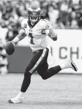  ?? Todd Olszewski / Getty Images ?? Eagles quarterbac­k Jalen Hurts has been inconsiste­nt throwing the ball this season, but he hasn't had any problems when he has had to run.