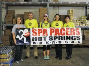  ??  ?? FOOD DRIVE: From left, Becky Chote, with Project Hope Food Bank, along with Spa Pacers Craig Durmon, Sarah Meadows, Patti Fleischner, and Cindy Baswell, promote the Spa Running Festival’s collection of food Saturday for the running of the 10K/5K, and...