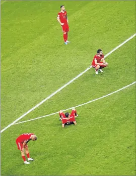  ?? Picture: REUTERS ?? DOWN AND OUT: Russian players look dejected after their match against Mexico