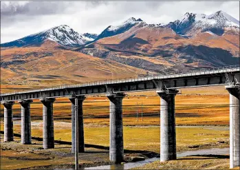  ?? DREAMSTIME ?? The Qinghai-Tibet Railway climbs to heart-thumping heights of over 16,000 feet as it snakes through the Himalayas.