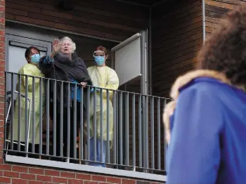  ??  ?? TOGETHER: Ciara Dwyer blows a kiss to her mum at St Mary’s Nursing Home. Her parents Mary and Rory, left, are residents there. Photo, right: David Conachy