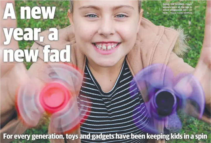  ?? Picture: GLENN HAMPSON ?? DOING THE ROUNDS: Fidget spinners were all the rage in school playground­s last term.