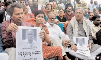  ??  ?? The late Gauri Lankesh (circled), who was murdered at her house on September 5, seen in this file picture with award winner Girish Karnad, and writers K. Marulasidd­appa, Bargur Ramachandr­appa when they mourned the death of renowned Kannada rationalis­t...