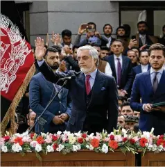  ?? ASSOCIATED PRESS ?? Abdullah Abdullah greets his supporters after being sworn in as president in Kabul during Afghanista­n’s dueling inaugurati­ons Monday.