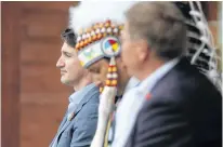  ?? SHANNON VANRAES • REUTERS ?? Earlier this week, Prime Minister Justin Trudeau visited the Cowessess First Nation in Saskatchew­an, where a search recently found 751 unmarked graves at a former residentia­l school site. Beside him is Cowessess Chief Cadmus Delorme.