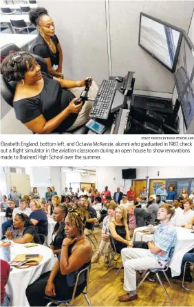  ?? STAFF PHOTOS BY DOUG STRICKLAND ?? Elizabeth England, bottom left, and Octavia McKenzie, alumni who graduated in 1987, check out a flight simulator in the aviation classroom during an open house to show renovation­s made to Brainerd High School over the summer. People listen to a presentati­on Sunday during an open house to show renovation­s made over the summer to Brainerd High School as part of the Brainerd Together project.