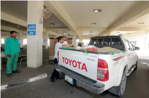  ?? AFP ?? A Qatari man checks the vehicle of a Saudi citizen at the Qatari side of the Abu Samrah border crossing with Saudi Arabia on Friday. —