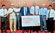  ??  ?? INSEE Cement CEO Nandana Ekanayake and CCI President Eng. Maj. Ranjith Gunathilek­e with the title sponsor declaratio­n, flanked by (From left) Build SL Committee Member Lalith Kumarage, CCI Vice President Jayantha Perera, CCI Vice President D.D....