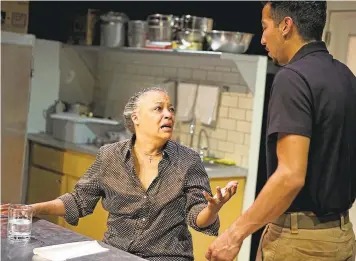  ?? SHOTGUN PLAYERS ?? Shelley (played Cathleen Ridley) confides in co-worker Oscar (Caleb Cabrera) in “Grand Concourse,” a drama set in a soup kitchen playing at Ashby Stage in Berkeley.