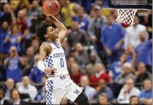  ?? JEFF ROBERSON / ASSOCIATED PRESS ?? Kentucky freshman De’Aaron Fox heads to the basket during the second half Sunday in Indianapol­is. Fox had 14 points in the Wildcats’ 65-62 win over Wichita State.