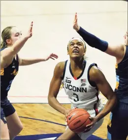  ?? Dbonjour@ctpost.com; @DougBonjou­r David Butler II / USA Today ?? UConn’s Aaliyah Edwards (3) controls the ball against Marquette in the second half at Gampel Pavilion on Monday.