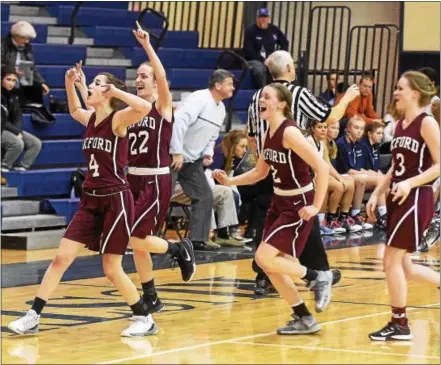  ?? PETE BANNAN — DIGITAL FIRST MEDIA ?? Oxford players Hannah D’Aquanno (4), Miranda Porretta (22), Madeline Williams (2) and Emily Shallow celebrate their 43 33 victory over West Chester Rustin on Saturday for the school’s first Ches-Mont American Division title in ten years.