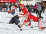  ?? MERCURY FILE PHOTO ?? Pottstown’s Brandon Tinson races through snow for a gainer as OJR’s Dawson Stuart attempts the tackle during the memorable 2014 game.