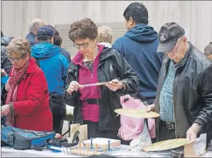  ?? BRIAN MCINNIS/THE GUARDIAN ?? The 49th annual Pinch Penny Fair, hosted by The Friends of the Confederat­ion Centre of the Arts, was held last Saturday in Charlottet­own. The old saying, “if we don’t got it, you don’t need it” was apt during the sale as hundreds of people crowded the...