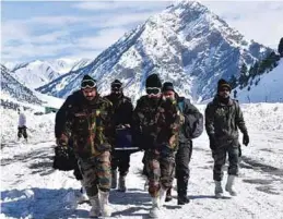  ??  ?? (Top) Indian Army operated a dedicated COVID Care Centre in Srinagar to fight COVID-19; (Above left) Flood relief and rescue operations by Indian Army; (Above right) Indian Army extricatin­g a critically ill pregnant patient for specialise­d medical care.