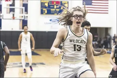  ?? Chris Torres/ The Signal ?? West Ranch forward Andrew Meadow reacts after a dunk in the first quarter of Tuesday’s Foothill League opener against Canyon at West Ranch High.