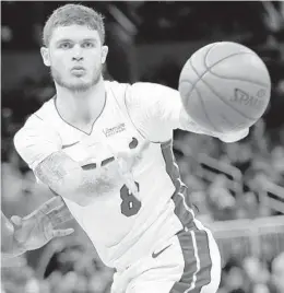  ?? JOHN RAOUX/AP ?? The Heat’s Tyler Johnson, passing during the first half, scored 20 points in the third quarter of a 115-91 win over the Magic on Sunday in Orlando.