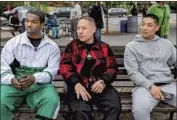  ?? Nicole Rivelli CNG ?? FILMMAKER Eddie Huang is f lanked by Bashar “Pop Smoke” Jackson, left, and Taylor Takahashi.
